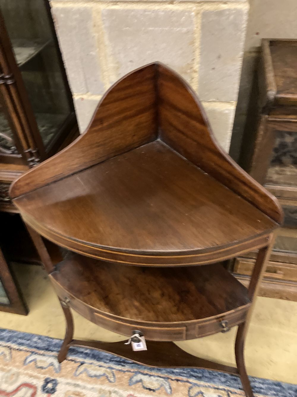 A George III mahogany corner washstand, width 60cm, depth 38cm, height 100cm